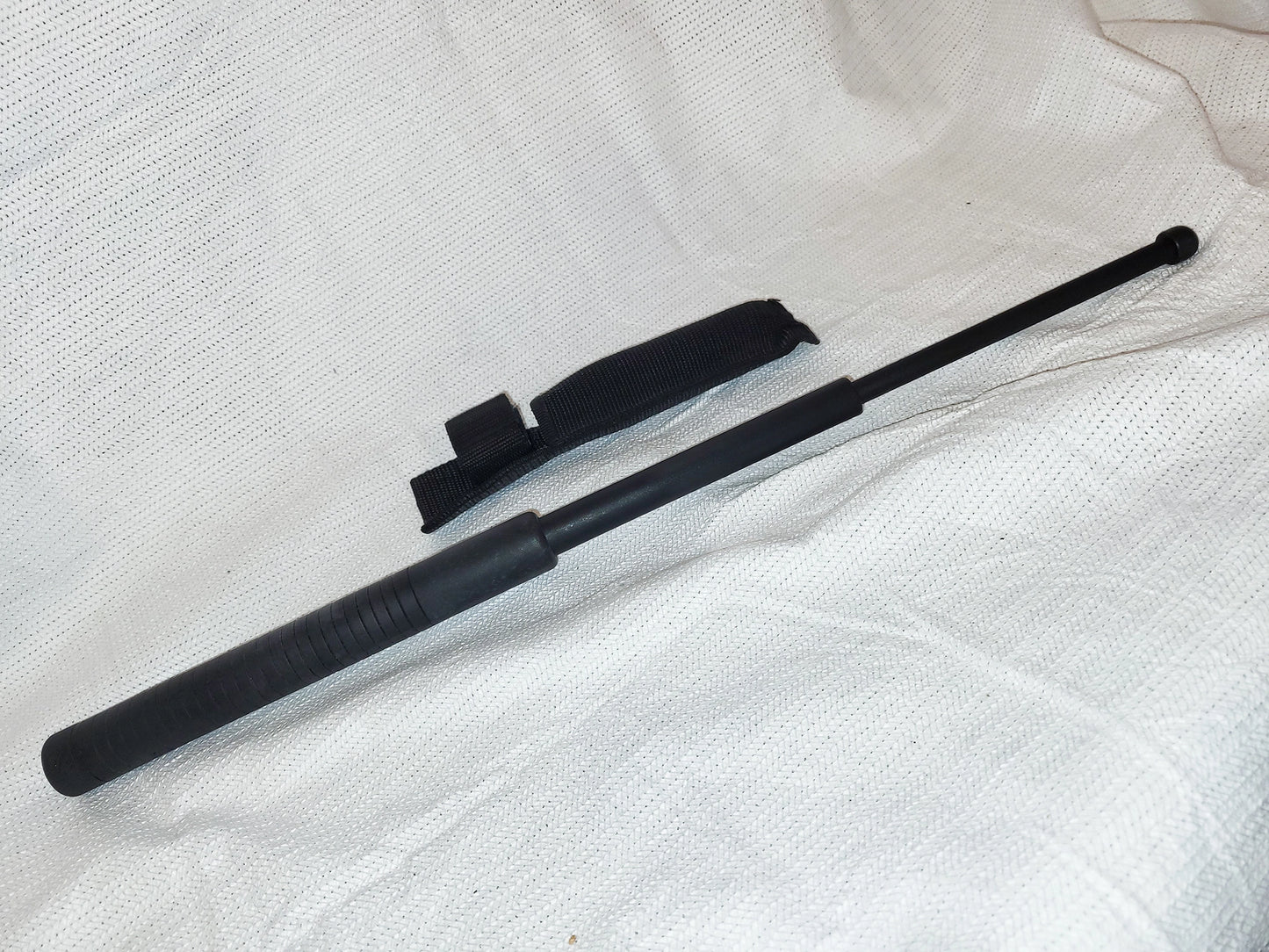 Extendable baton, black, polymer with sheath